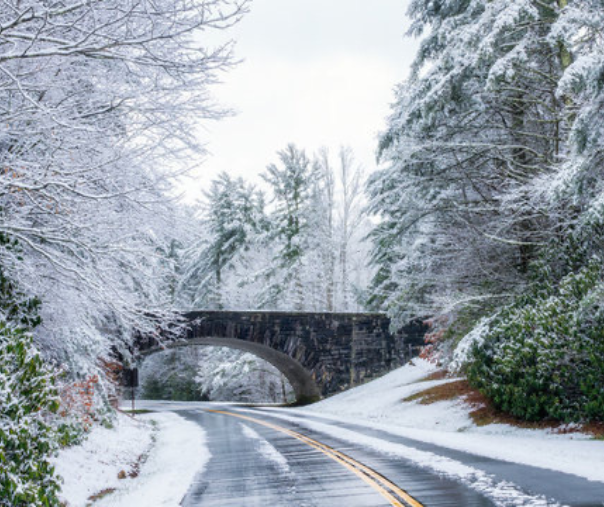 The mountain road covered in snowfall 
