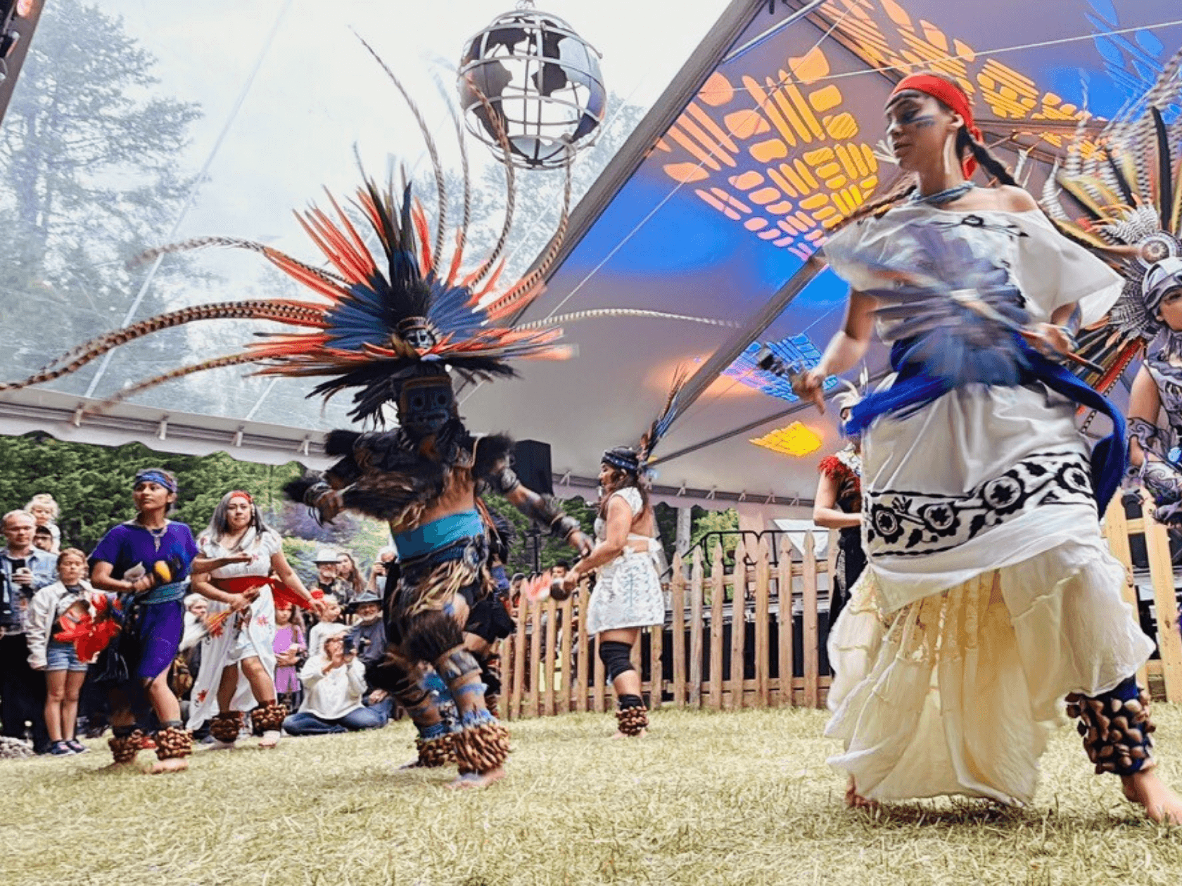 Two performers doing an historical dance on stage at a festival