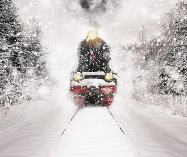 A steam Engine plowing through snow storm