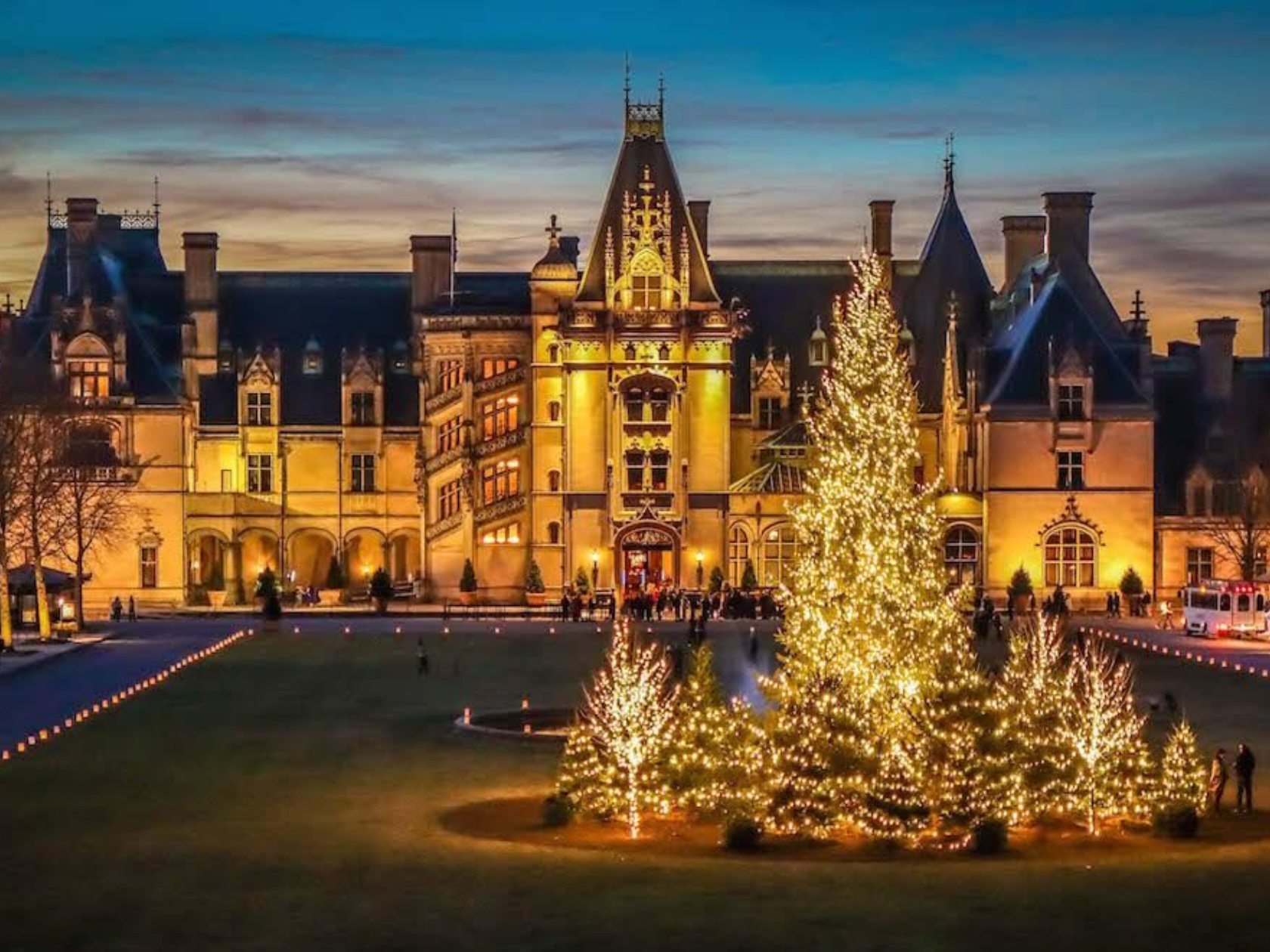 Biltmore castle covered in holiday lighting 